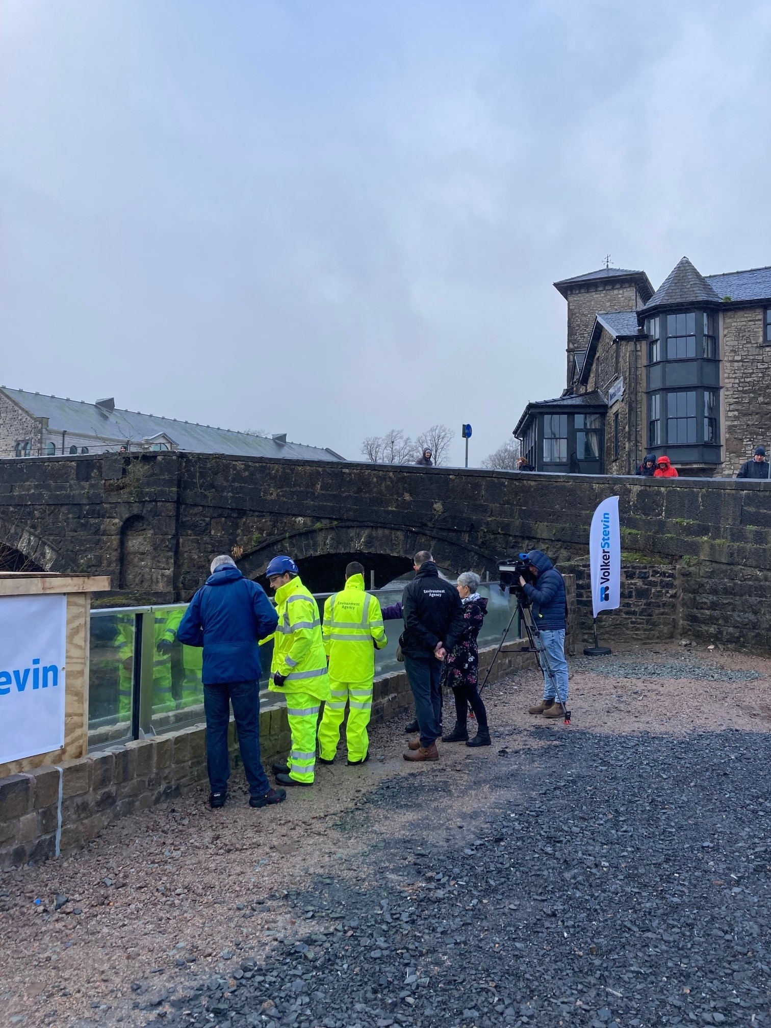 ITV BOrder, Cumberland Council , Kendal Town Council and EA representatives viewing the first glass panels.jpg